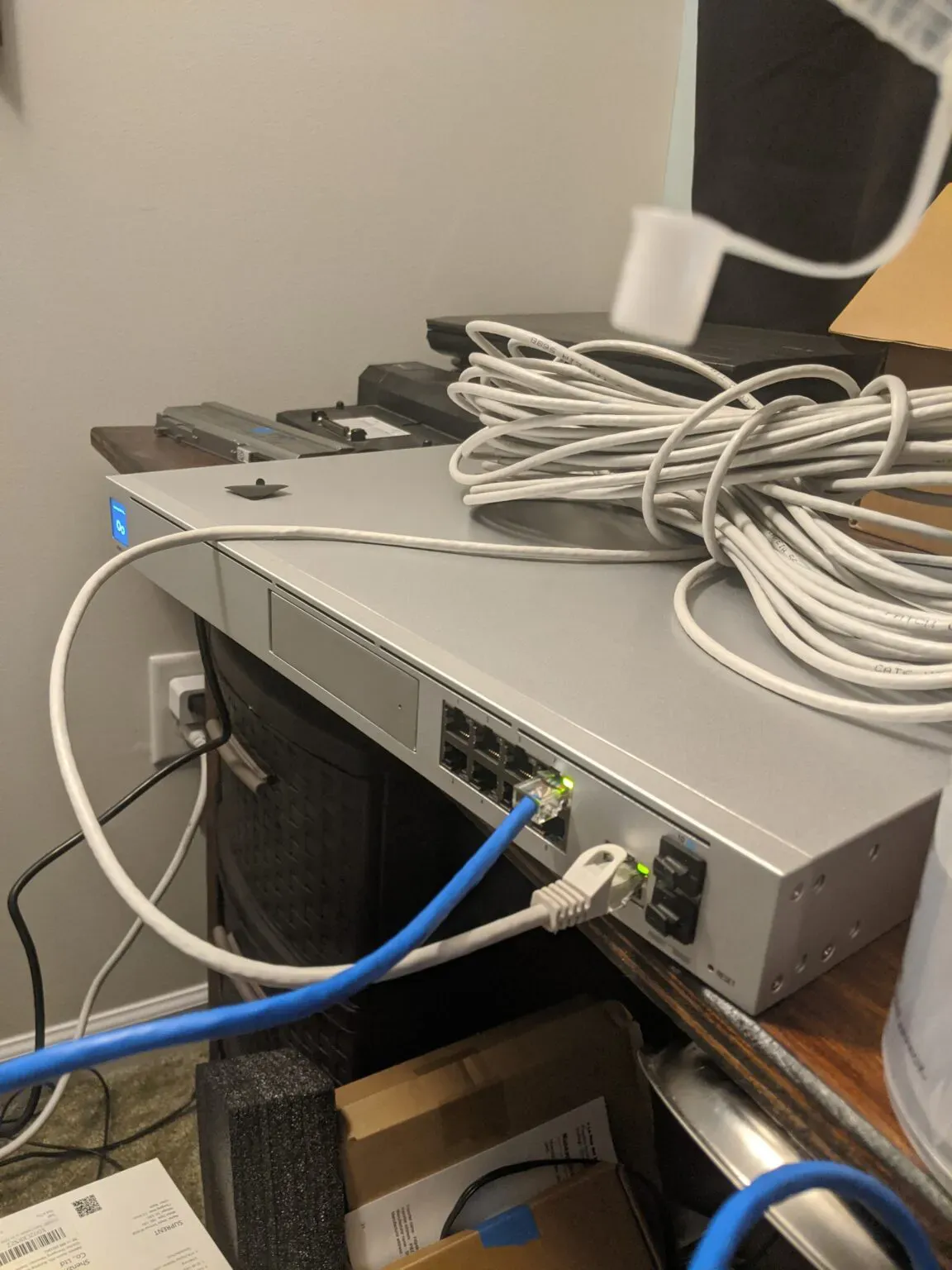 This picture was taken during the setup of my UDM-P at home before it went into the rack. You can clearly see all the frontal features, including the LCM display.